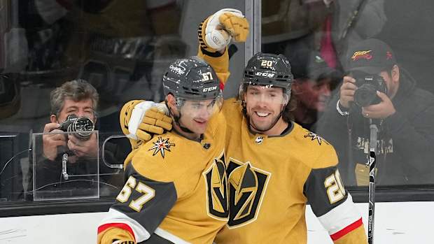 Apr 9, 2022; Las Vegas, Nevada, USA; Vegas Golden Knights left wing Max Pacioretty (67) celebrates with Vegas Golden Knights center Chandler Stephenson (20) after scoring a goal against the Arizona Coyotes during the first period at T-Mobile Arena. Mandatory Credit: Stephen R. Sylvanie-USA TODAY Sports